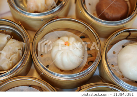 steamed stuff bun or chinese steamed pork buns in dim sum set in restaurant 113843391