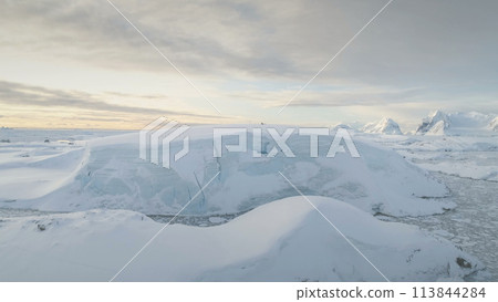 Antarctica Snow Hill Aerial Drone View. Climate Change. Antarctic Continent Expedition at Ocean Coastline. Polar Landscape. Global Warming and Melting Ice Concept. Top Flight 113844284
