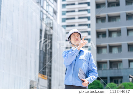 Business man in work clothes at construction site Business man in work clothes at construction site 113844687