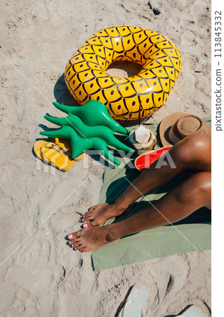Sunbathe at the beach Women's feet, sandals and fruit Sunbathe at the beach Women's feet, sandals and fruit 113845332
