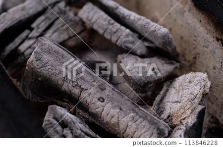 Burning charcoal Burning charcoal 113846228
