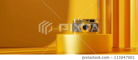 Vintage camera on display against a vibrant golden yellow background 113847801