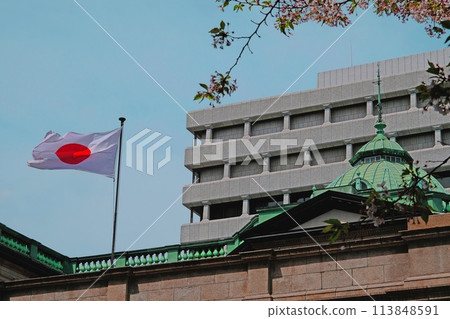 Bank of Japan Head Office and cherry blossoms falling Bank of Japan Head Office and cherry blossoms falling 113848591