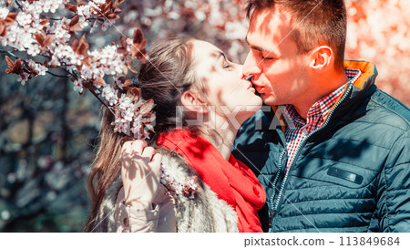 Couple in love walking in park at sunny spring day 113849684