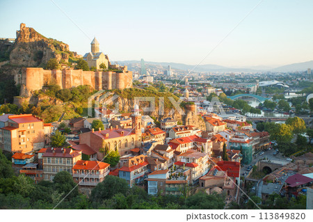 Landscape of old Tbilisi and Metekhi Church on the background of blue cloudy sky Landscape of old Tbilisi and Metekhi Church on the background of blue cloudy sky 113849820