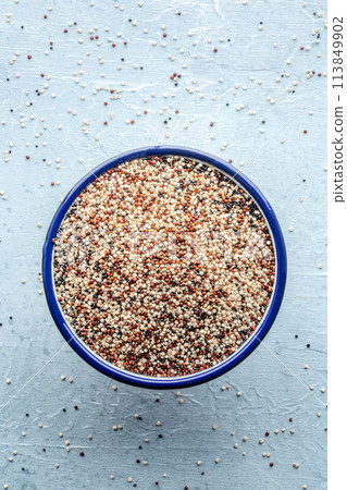 Quinoa mix. Mixed white, red and black quinoa seeds in a bowl 113849902