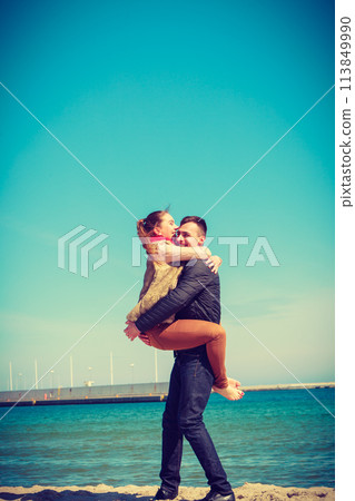 Happy couple having date on beach Happy couple having date on beach 113849990
