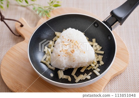 Salted rice balls and cheese in a frying pan Salted rice balls and cheese in a frying pan 113851048
