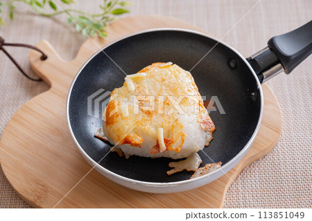 Cheese rice balls baked in a frying pan Cheese rice balls baked in a frying pan 113851049