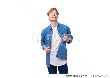 young well-groomed caucasian red-haired man in a denim shirt looks stylish 113852124