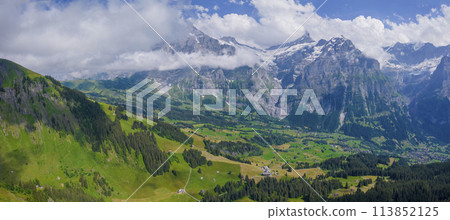 View on the alpine valley Grindelwald. Jungfrau, Switzerland. Under the Bernese alps. Mountain village. 113852125