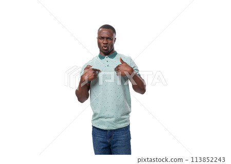 a young charismatic American guy dressed in a mint T-shirt points to himself 113852243