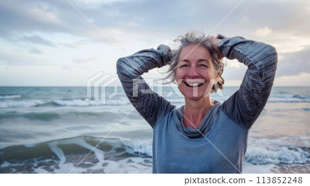 Joyful Senior Woman Relaxing at the Beach with a Radiant Smile. AI generative 113852248