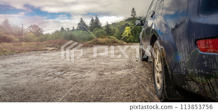 car for traveling with a mountain road 113853756