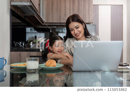 Working mom work from home office. businesswoman and cute child using laptop work freelancer workplace in home, Lifestyle family moment Working mom work from home office. businesswoman and cute child using laptop work freelancer workplace in home, Lifestyle family moment 113853862