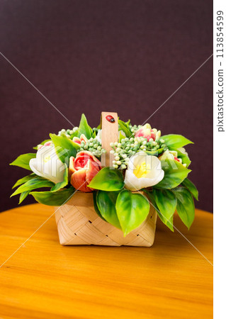 Cute bouquet of handmade soap flowers on a small table Cute bouquet of handmade soap flowers on a small table 113854599