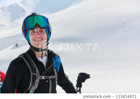 Portrait of a Professional Skier's Blissful Relaxation atop the Snowy Alps 113854871