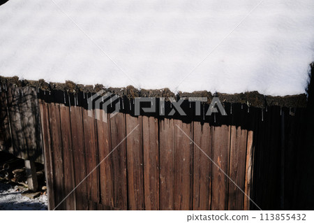 Icicles hanging from a hut 113855432