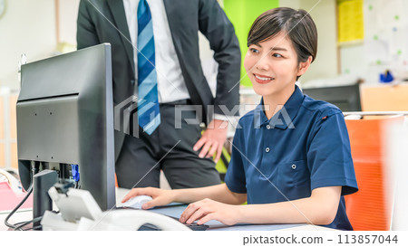 Work staff doing paperwork Work staff doing paperwork 113857044