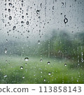 A rainy day window with water drops 113858143
