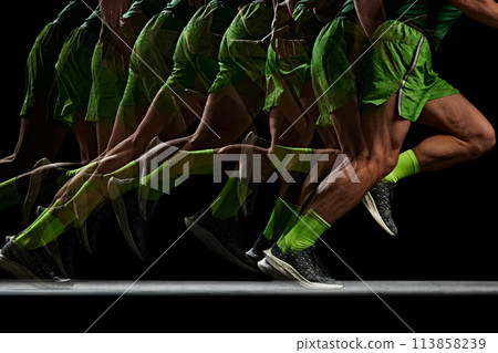 Energy and strength. Cropped image of athletic, muscular male legs in motion, running against black background with stroboscope effect Energy and strength. Cropped image of athletic, muscular male legs in motion, running against black background with stroboscope effect 113858239