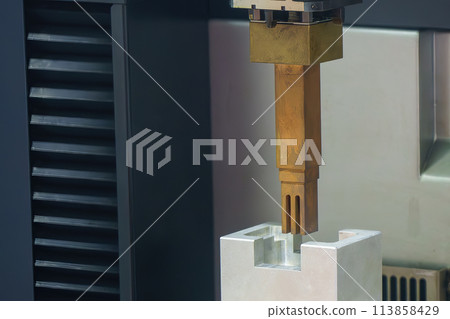 The copper electrode demonstration working on EDM machine. The copper electrode demonstration working on EDM machine. 113858429