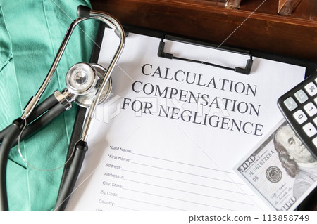 Document for calculating negligence compensation, with a stethoscope, money, and calculator on a medical uniform background. Document for calculating negligence compensation, with a stethoscope, money, and calculator on a medical uniform background. 113858749