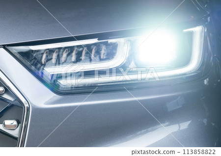 Bright led headlight of gray car 113858822