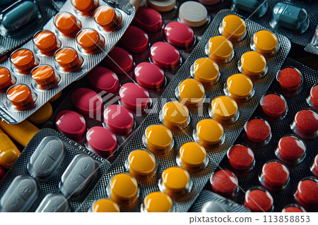 medical capsules with vitamins and medicines in a blister. pharmacology and medicine medical capsules with vitamins and medicines in a blister. pharmacology and medicine 113858853