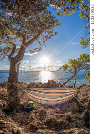 Hammock net installed on Punta Rata beach in Brela, Croatia, Dalmatia, Croatian azure coast. 113859586