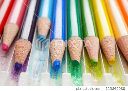 A set of colored pencils that have been used up and have rounded tips A set of colored pencils that have been used up and have rounded tips 113860088