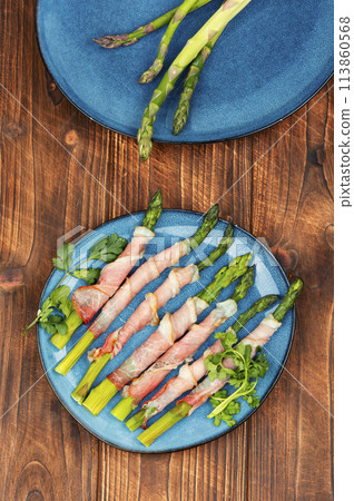 Green asparagus prosciutto ham wraps Green asparagus prosciutto ham wraps 113860568