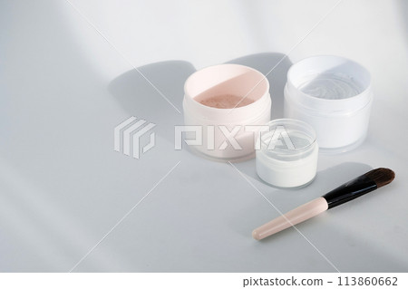 Flat lay with blue clay facel mask in jar. Beauty background with facial cosmetic products. Spa concept. Beauty blogger, salon treatments concept. Minimalism. 113860662