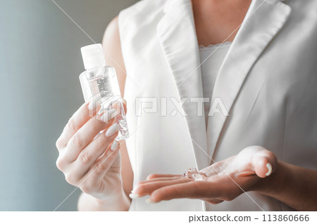 Women washing hands with antibacterial sanitizer gel. Hygiene concept. Prevent the spread of germs and bacteria and avoid infections corona virus 113860666
