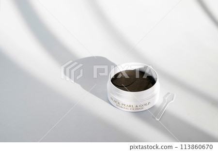 Package with collagen eye patches on white background. Korean hydrogel eye patch 113860670