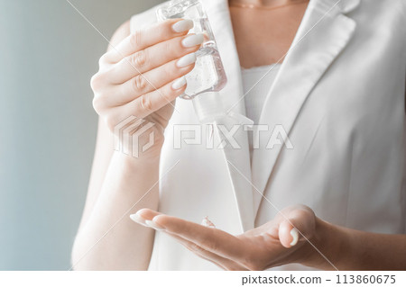 Women washing hands with antibacterial sanitizer gel. Hygiene concept. Prevent the spread of germs and bacteria and avoid infections corona virus 113860675