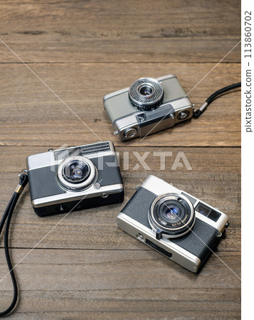 Three compact film cameras 113860702