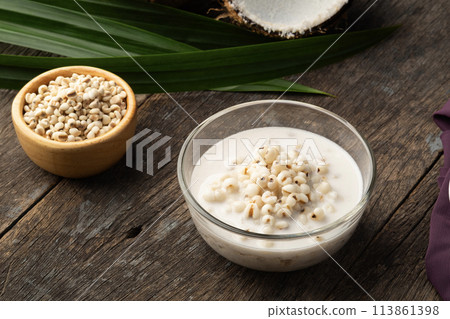 Job's tears in Sweet Coconut Milk,Boiled millet with coconut soup in glass bowl. 113861398