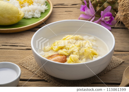 Thai sweet food,Cooked sticky rice in sweet coconut milk with Durian fruit in white bowl,popular dessert in Thailand Thai sweet food,Cooked sticky rice in sweet coconut milk with Durian fruit in white bowl,popular dessert in Thailand 113861399
