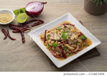 Spicy minced pork salad ,Laab moo ,Mixed Pork with boiled skin and liver in spicy lime sauce 113861406