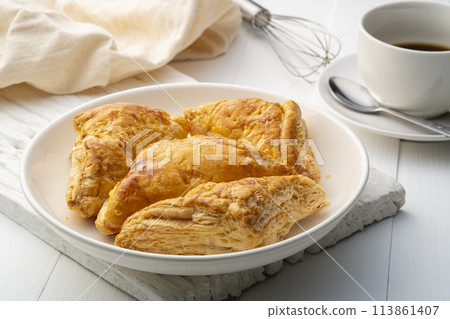Baked Chicken Puff Pastry in white plate,healthy snacks Baked Chicken Puff Pastry in white plate,healthy snacks 113861407