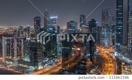 Dubai's business bay towers aerial night timelapse. 113861596
