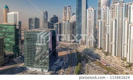 Modern residential and office complex with many towers aerial timelapse at Business Bay, Dubai, UAE. 113861624