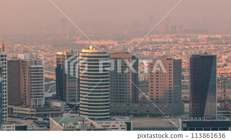 Dubai's business bay towers at morning aerial timelapse. Dubai's business bay towers at morning aerial timelapse. 113861636
