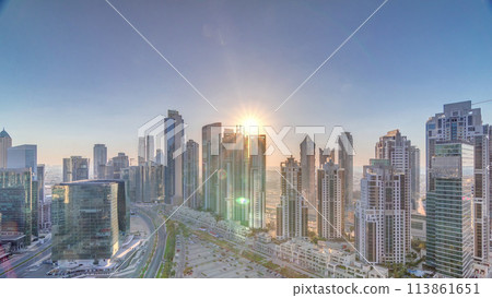 Modern residential and office complex with many towers aerial timelapse at Business Bay, Dubai, UAE. Modern residential and office complex with many towers aerial timelapse at Business Bay, Dubai, UAE. 113861651