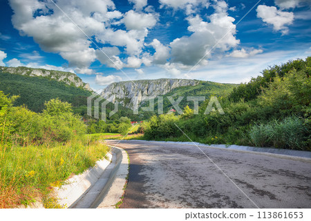 Amazing view of Turda Gorge (Cheile Turzii) natural reserve with marked trails for hikes on Hasdate river. Amazing view of Turda Gorge (Cheile Turzii) natural reserve with marked trails for hikes on Hasdate river. 113861653