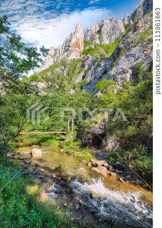 Amazing view of Turda Gorge (Cheile Turzii) natural reserve with marked trails for hikes on Hasdate river. Amazing view of Turda Gorge (Cheile Turzii) natural reserve with marked trails for hikes on Hasdate river. 113861663