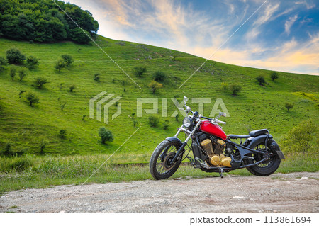 Amazing view of Turda Gorge (Cheile Turzii) natural reserve with motorcycle on parking. Amazing view of Turda Gorge (Cheile Turzii) natural reserve with motorcycle on parking. 113861694