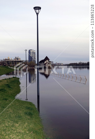 Kyiv, Ukraine April 17, 2023: Flooding - flooding of the embankment in a new area in the city of Kyiv Kyiv, Ukraine April 17, 2023: Flooding - flooding of the embankment in a new area in the city of Kyiv 113865228