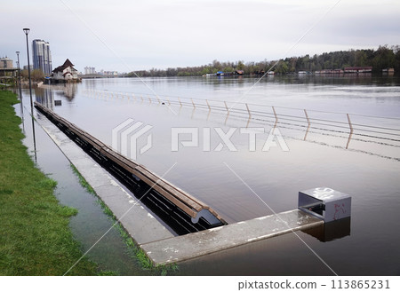 Kyiv, Ukraine April 17, 2023: Flooding - flooding of the embankment in a new area in the city of Kyiv 113865231